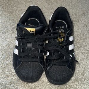 Adidas Kids Black and White Sneakers with Gold Accents